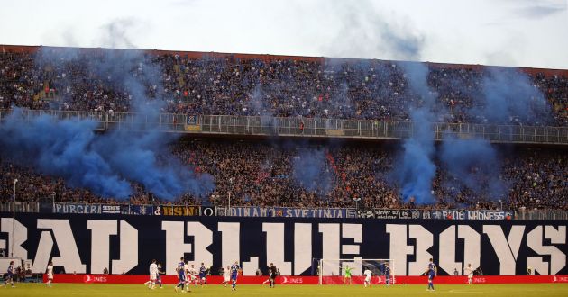 Dinamo Zagreb supporters look on through smoke during the UEFA Champions League Group E football match between Dinamo Zagreb (CRO) and Chelsea (ENG) at The Maksimir Stadium in Zagreb on September 6, 2022. (Photo by Damir Sencar / AFP) (Photo by DAMIR SENCAR/AFP via Getty Images)