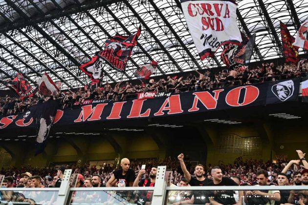 AC Milan fans celebrate in the stands during the Italian Serie A football match between AC Milan and Atalanta Bergamo at the San Siro stadium in Milan on May 15, 2022. - AC Milan beat Atalanta Bergamo 2-0. (Photo by Miguel MEDINA / AFP) (Photo by MIGUEL MEDINA/AFP via Getty Images)