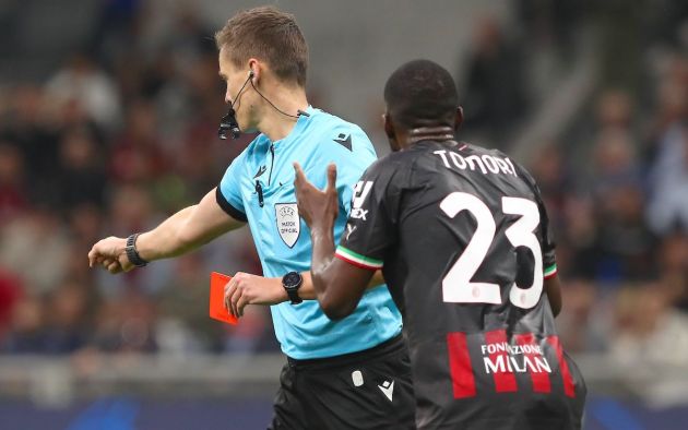 Referee Daniel Siebert shows the red card to Fikayo Tomori of AC Milan