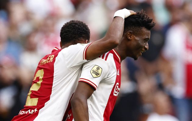 Ajax's Jurrien Timber (L) and teammate Mohammed Kudus