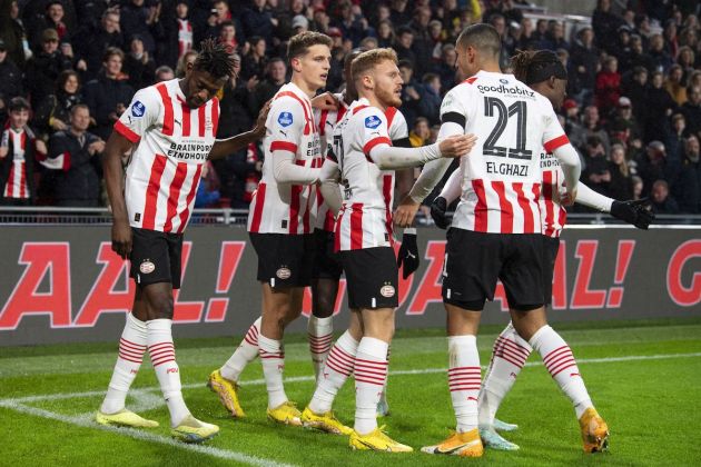 PSV's Dutch midfielder Guus Til (2L) celebrates with teammates after scoring the first goal during the friendly football match between PSV Eindhoven and AC Milan at the Philips stadium in Eindhoven on December 30, 2022. - Netherlands OUT (Photo by Olaf KRAAK / ANP / AFP) / Netherlands OUT (Photo by OLAF KRAAK/ANP/AFP via Getty Images)