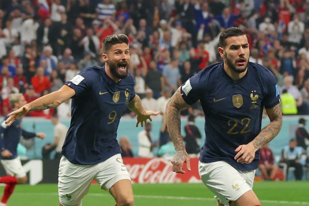 France's defender #22 Theo Hernandez celebrates, with France's forward #09 Olivier Giroud running behind, after scoring his team's first goal during the Qatar 2022 World Cup semi-final football match between France and Morocco at the Al-Bayt Stadium in Al Khor, north of Doha on December 14, 2022. (Photo by Adrian DENNIS / AFP) (Photo by ADRIAN DENNIS/AFP via Getty Images)