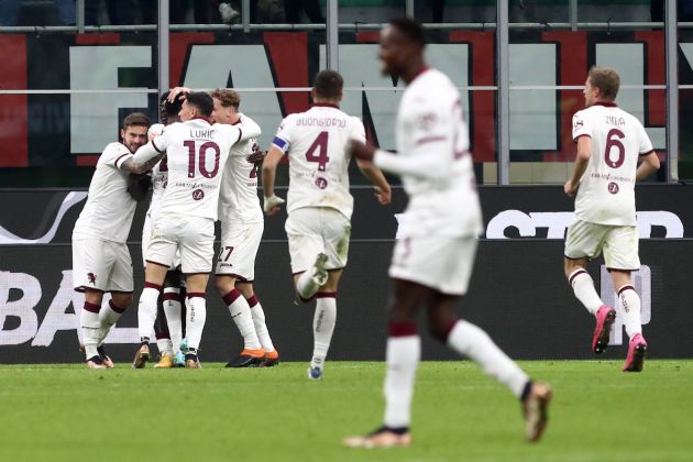 MILAN, ITALY - JANUARY 11: Michel Ndary Adopo of Torino FC (obscured) celebrates with teammates after scoring the team's first goal during the Coppa Italia match between AC Milan and Torino FC at Stadio Giuseppe Meazza on January 11, 2023 in Milan, Italy. (Photo by Marco Luzzani/Getty Images)
