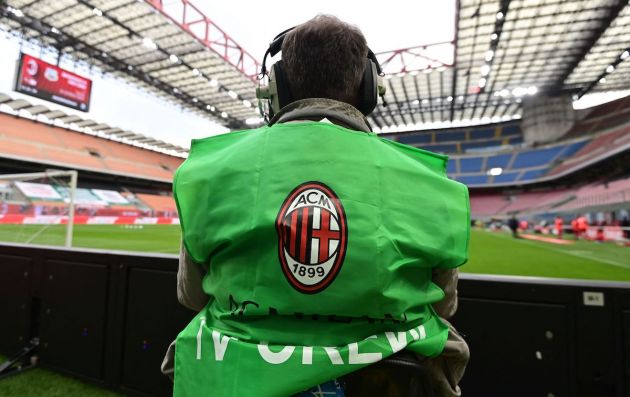 A television cameraman, wearing a bib with the logo of AC Milan, waits prior to the Italian Serie A football match AC Milan vs Sassuolo on April 21, 2021 at the San Siro stadium in Milan. - The two Milan giants and Atletico Madrid followed all six English Premier League clubs in pulling out of the European Super League on April 21, 2021, dealing a fatal blow to the project. (Photo by MIGUEL MEDINA / AFP) (Photo by MIGUEL MEDINA/AFP via Getty Images)