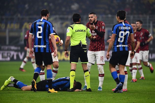 AC Milan's defender Theo Hernandez from France argues with referee Fabio Maresca