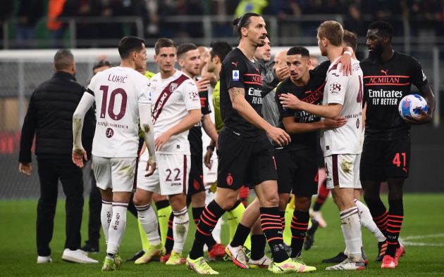 AC Milan's players and Torino's players greet each others