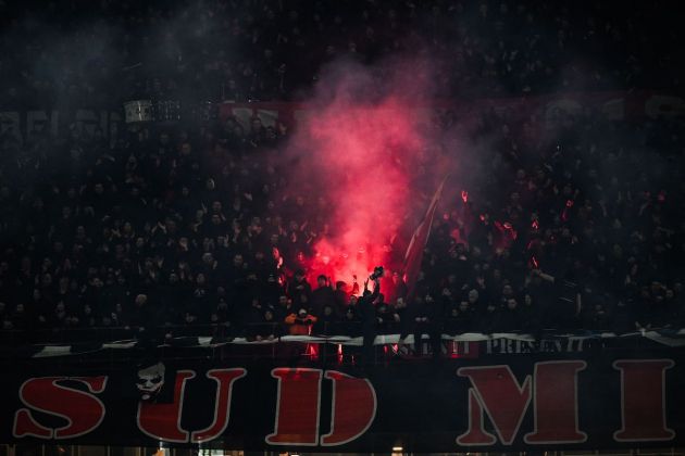 AC Milan fans cheer during the Italian Serie A