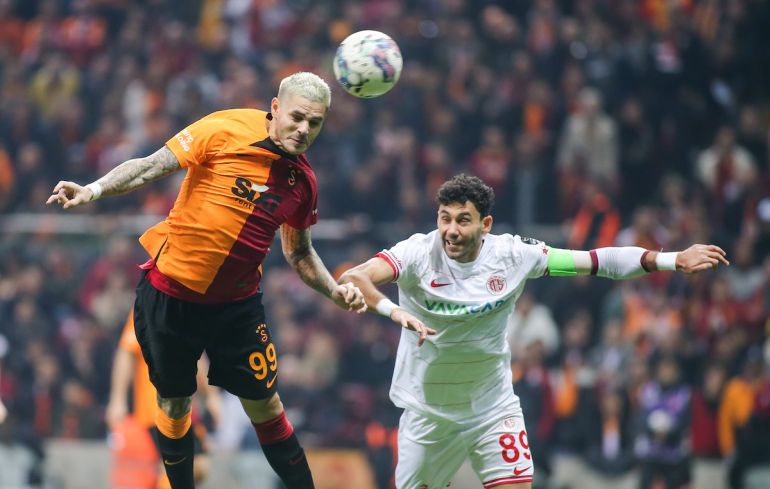 Galatasaray's Mauro Icardi, top, heads the ball with Manchester