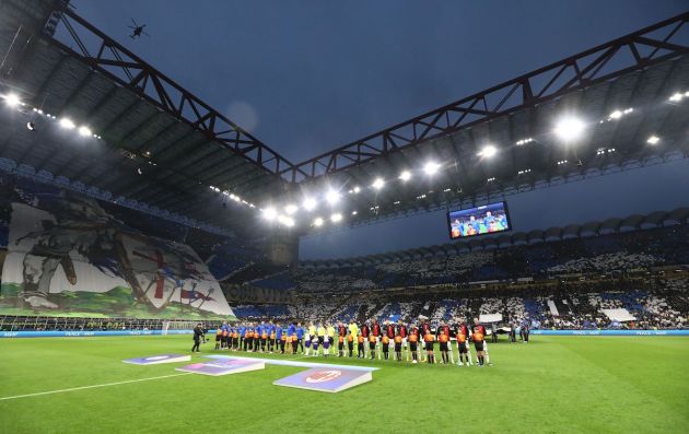Players of FC Internazionale and AC Milan line up