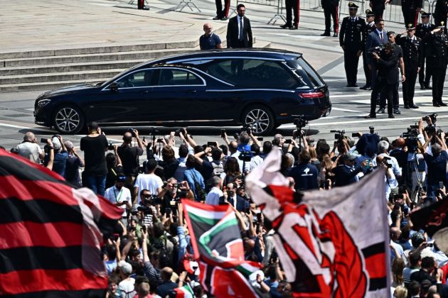 The hearse transporting the coffin of Italy's former prime minister and media mogul Silvio Berlusconi