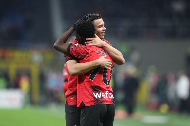Chaka Traore of AC Milan (L) celebrates with teammate Jan-Carlo Simic