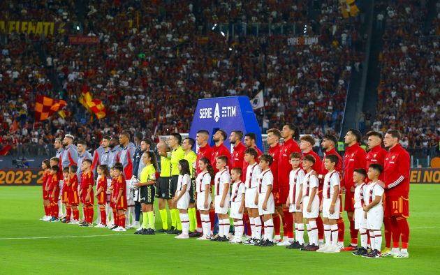 Players of AS Roma and AC Milan line up
