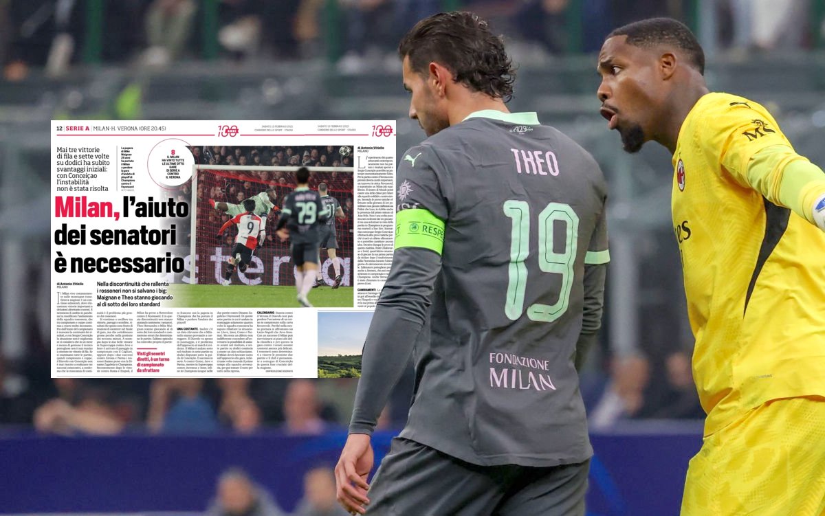Goalkeeper Mike Maignan of AC Milan speaks to teammate Theo Hernandez